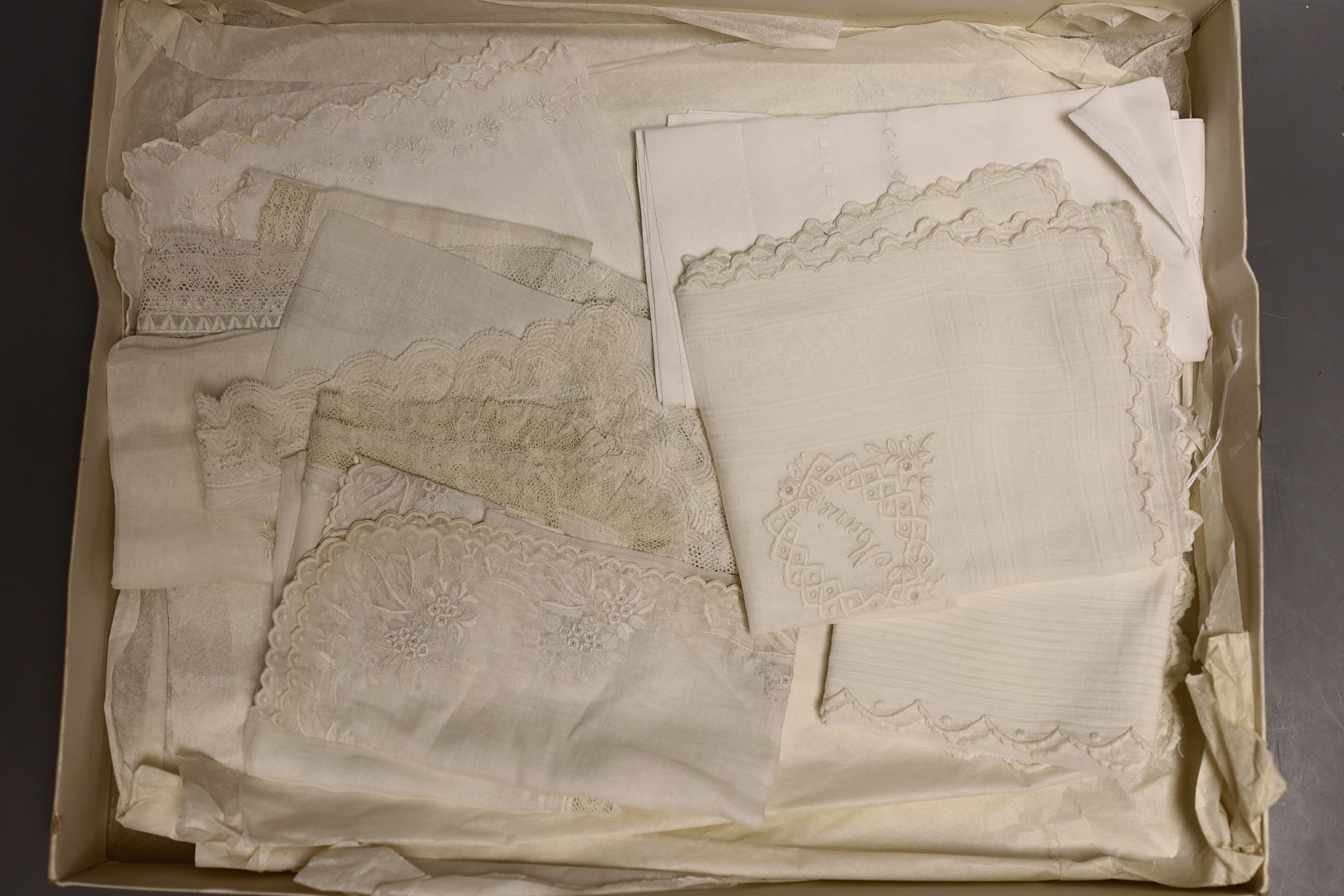 A lace box containing three 19th century Brussels bobbin lace and needle lace hankies and two fine tape lace hankies and a needle run hankie